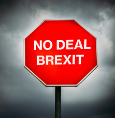 No Deal Brexit written on octagon stop sign with storm clouds in background