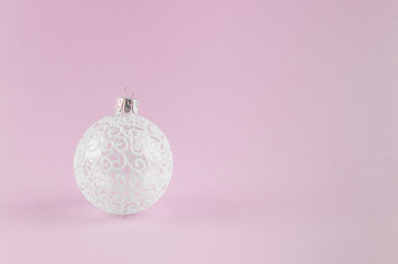 Beautiful New Year's ball on a pink background. New Year, Christmas