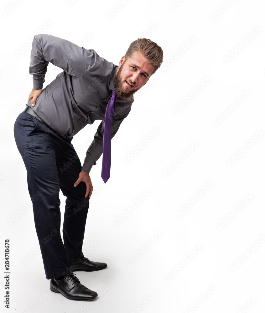 Wall mural Business man with back pain isolated on a white background