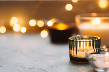 Hygge background with candles and festive on windowsill. Cosy home concept