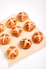 Buns marked with a cross and containing dried fruit, traditionally eaten during Lent.