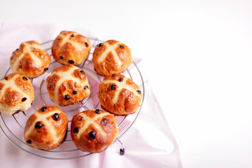 Buns marked with a cross and containing dried fruit, traditionally eaten during Lent.
