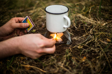 Mulled wine in a metal cup with clove cinnamon, star anise and cardamom