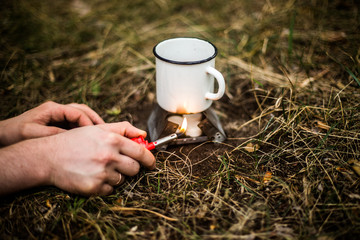 Mulled wine in a metal cup with clove cinnamon, star anise and cardamom