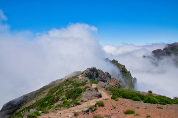 Fototapeta na wymiar Landscape of hiking trail from Pico do Arieiro to Pico Ruivo, Madeira island, Portugal in summy summer day above the clouds