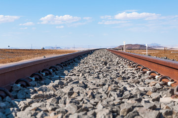 Fototapeta na wymiar Low down view of the trans Namib rail line at Haalenberg, Namibia