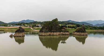 Fototapeta na wymiar Panorama of Dodamsambong Peaks. Three stone peaks rising out of the Namhangang River. Danyang, North Chungcheong, South Korea, Asia.