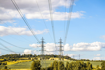 Beautiful landscape with electric lines and high voltage transmission towers