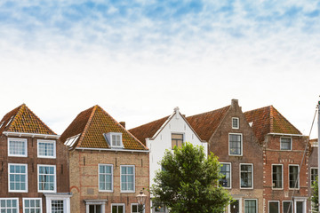 Fototapeta na wymiar Row houses along water in Veere, The Netherlands