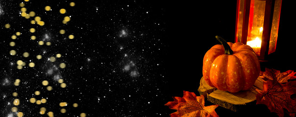 Bright pumpkin on a black background. Halloween and Thanksgiving traditional decoration. Place for text..Autumn cozy background. Place for text.