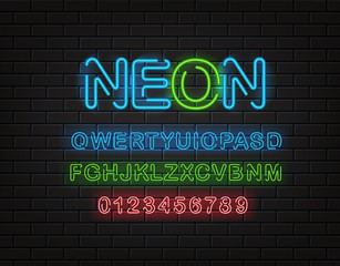 Fototapeta premium Neon font clipart. Latin alphabet and digits on a brick wall