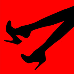office lady dangles high heel shoe from her foot