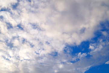 Large white cumulus clouds on a blue sky for background or ecology or nature.