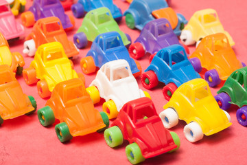 Toys  plastic cars on a red background