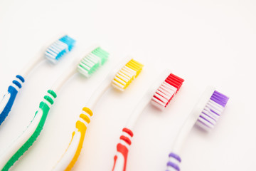 set of plastic toothbrushes on white background