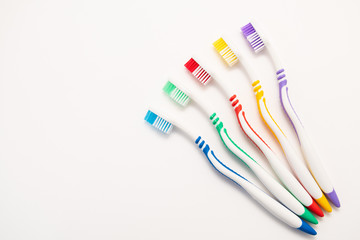 set of plastic toothbrushes on white background