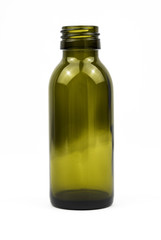 Little green glass bottle shot in a white studio.