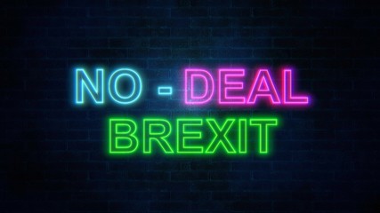 The word No-Deal Brexit with neon colours on brick wall. 