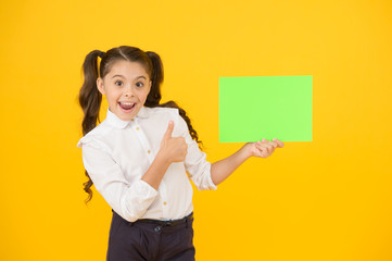 Changes coming. Upcoming event. Look here. Girl school uniform hold poster. Back to school concept....