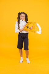 Future architect. Engineering course. Geometry concept. Schoolgirl holding protractor for lesson....