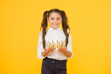 Beautiful princess. Queen of class. School competitions concept. Adorable small child crowned...