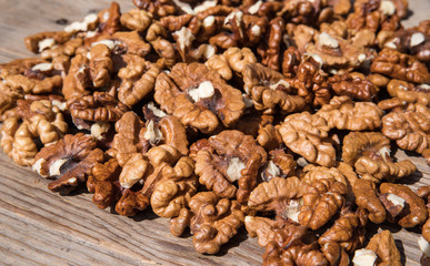 Walnuts on wooden background.