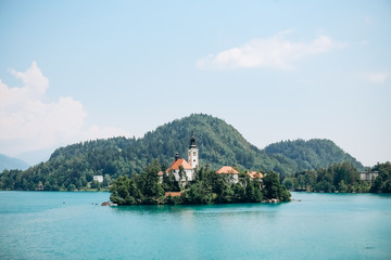 island prayer cathedral bled lake mountains background