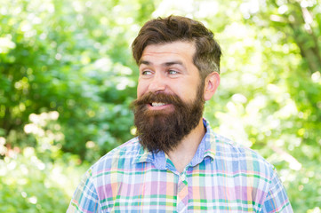 The joy of best hairstyle. Bearded man smiling with fashion hairstyle in summer. Happy hipster with...