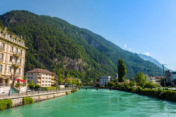 Fototapeta na wymiar Beautiful landscape photo of River Aare with turqouise water in Interlaken, Switzerland.