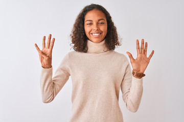 Young brazilian woman wearing turtleneck sweater standing over isolated white background showing...