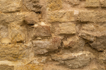 Rocky brick wall. stone wall background. abstract grunge texture. old brown masonry