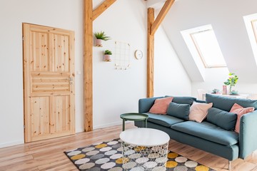 Modern bright living room with textile sofa