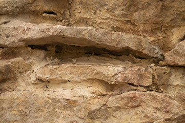 Rocky brick wall. stone wall background. abstract grunge texture. old brown masonry