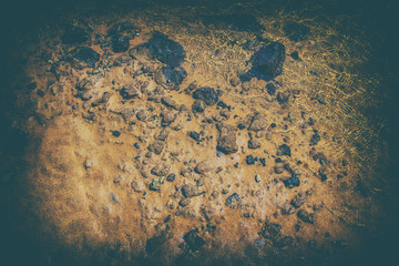 Background with red sands of volcanic origin, stones and ocean water, Fuerteventura, Canary islands, Spain.
