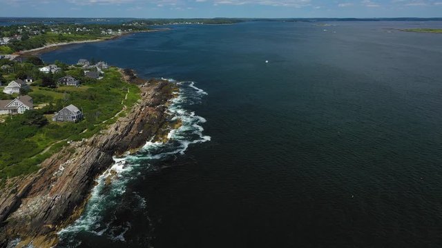 Flight over scenic rocky coast Giants Stairs, Harpswell reveal Horizon.