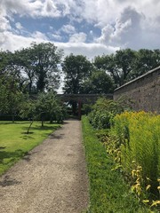 Walled garden in Duckett's Grove, Carlow, Ireland. Summer flowers around castle