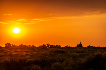 Sunset church cross silhouette in sunset sky clouds. Sunset church silhouette.