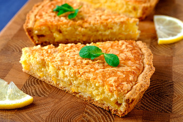 piece of lemon pie on a wooden board