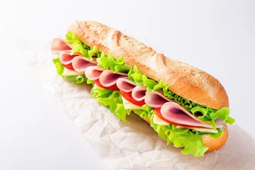 Foto op Canvas Ham sandwich on a paper bag on white © tremasov_sergei