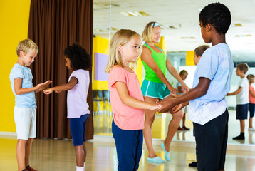 Preteen kids training in dance studio