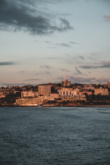 The first rays of morning sun hit the South Bondi Headland on a cold winter morning.