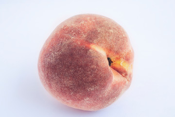 Red peach with leaf isolated on white background. Full depth of field (all details in focus). Clipping path included.