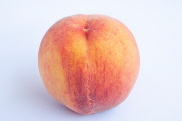 Red peach with leaf isolated on white background. Full depth of field (all details in focus). Clipping path included.