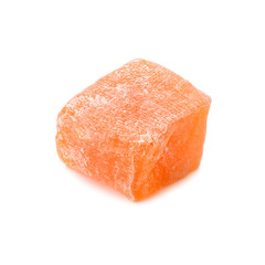 Turkish delight. Pomegranate rahat locum, one piece of sweet oriental delights in powered sugar. Close-up view.