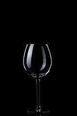 Glass of red wine on black background