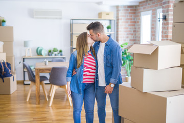 Young beautiful couple in love moving to new home, very happy and cheerful for new apartment