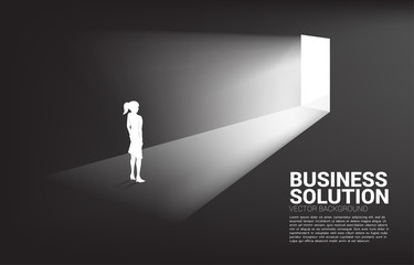 Silhouette of businesswoman standing in front of exit door. Concept of career start up and business solution.