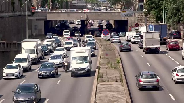 Time lapse - Heavy Road Traffic in Paris  - france - Juin 21 2019 Cars, Motorbikes and Different Vehicles Driving On The Road