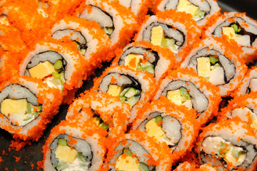 close-up of sushi rolls on buffet line