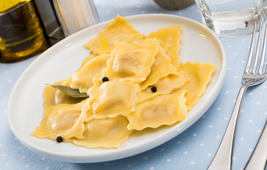 Delicious appetizing ravioli with bay leaf and black pepper